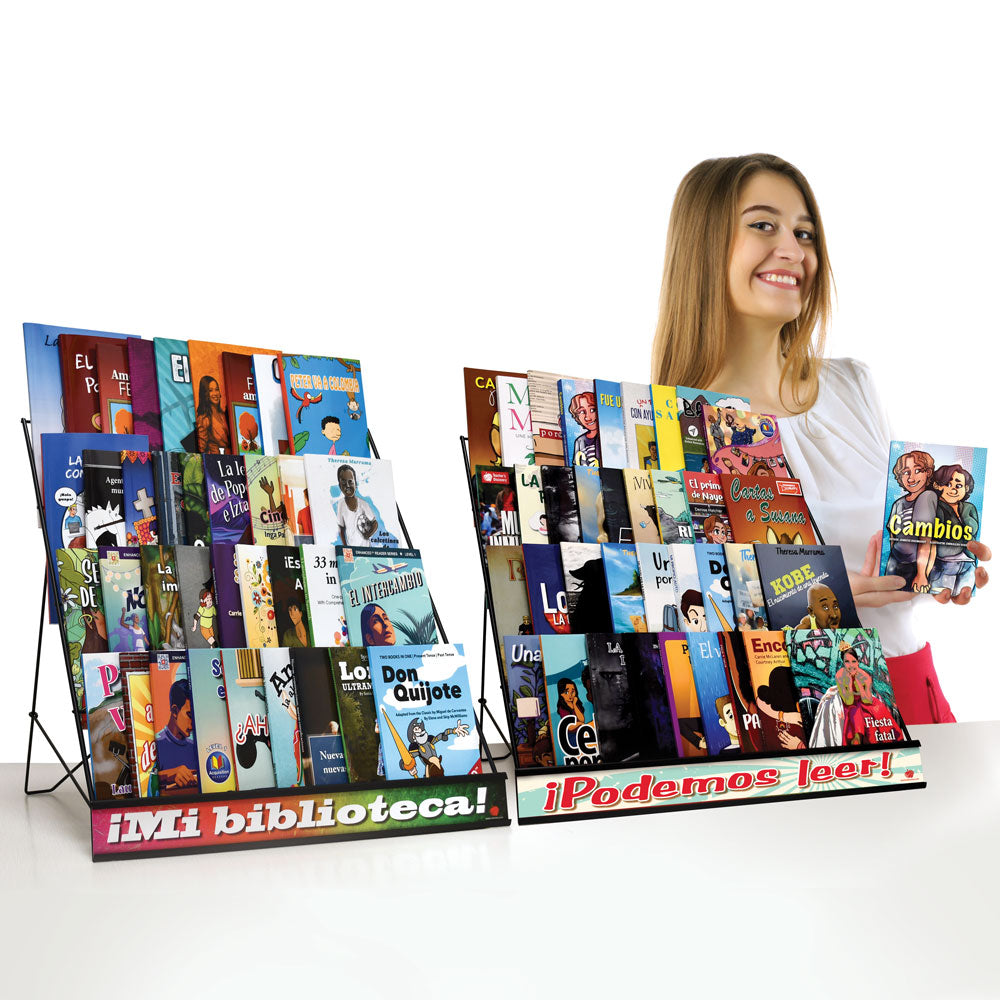Student holding Spanish free voluntary reading book next to FVR library display with classroom reader collection.