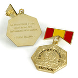Gold Spanish honor medal with engraved Pablo Picasso quote on reverse and red and gold enamel Spanish flag design.